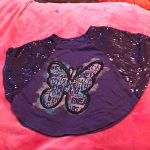 A sparkly purple shirt